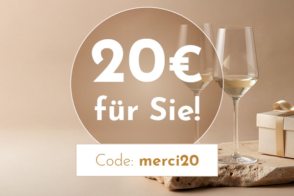 Zwei Weingläser stehen auf einem Stein, daneben befindet sich ein Geschenk. Der Text bietet einen 20€ Gutschein für den Code -merci20- an.